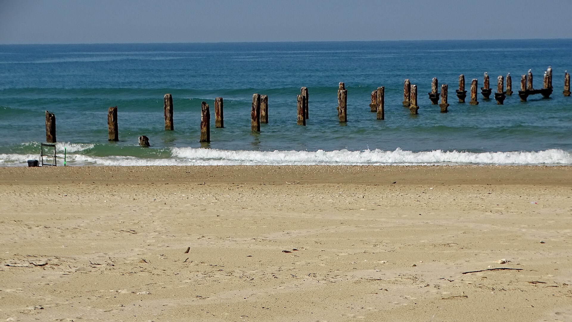 The broken fishing pier at Beit Yanai beach on the Mediterranean coast of Israel