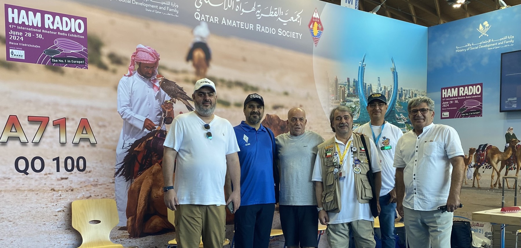 Amir with amateur radio operators at the A71A booth, Friedrichshafen. 30 June 2024.